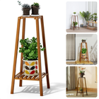 Bamboe plantenstandaard Cheqo® met twee lagen, donker gelakt, met planten en decoratief potontwerp, geschikt voor binnen en buiten.