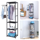 Cheqo® kledingrek met zwart metalen frame, drie legplanken en hangruimte voor kleding en accessoires, ideale garderobe-oplossing.