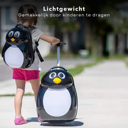 Child walking with Cheqo® penguin trolley and backpack set, perfect for kids' travel.