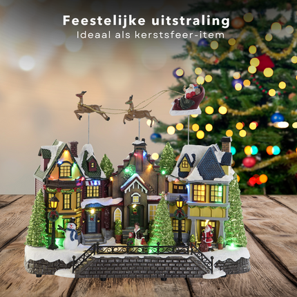 Cheqo® Kerstdorp Vliegende Arreslee - Kersthuisje - Kersttafereel met LED Verlichting - 35 cm - Kunststof - Met Muziek